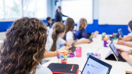 Students work with tablets in the classroom