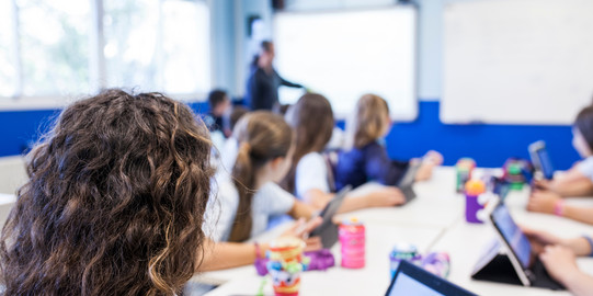 Digitalization Students work with tablets in the classroom
